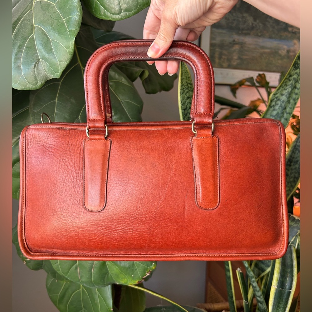 SOLD.    Vintage Coach 1980’s Rust NYC Compact Slim Satchel 9425